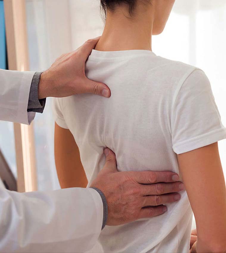 Female patient having a spinal decompression consultation