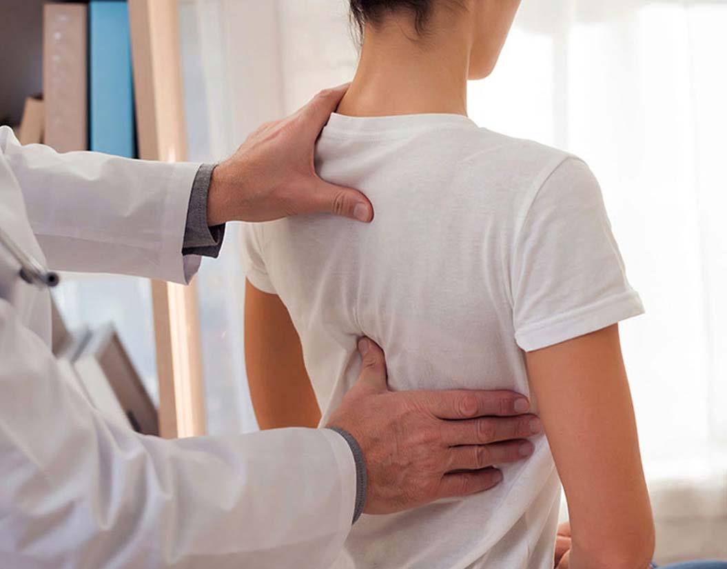 Female patient having a spinal decompression consultation